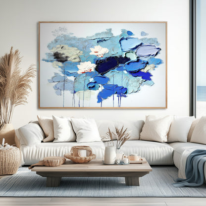  Large original abstract painting above a neutral-toned sofa, completing a sleek, minimalist interior design.