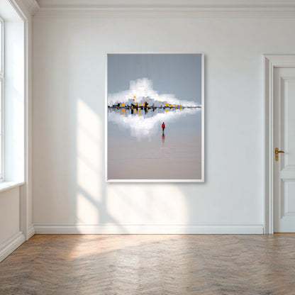 Framed artwork of a person standing on water with a cloud reflection, in a room with wooden flooring and a white wall.
