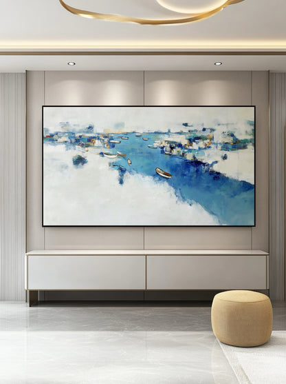 Expansive abstract blue harbor painting centering a sleek, low white console, creating a balanced horizontal focal point in a modern, luxurious room.