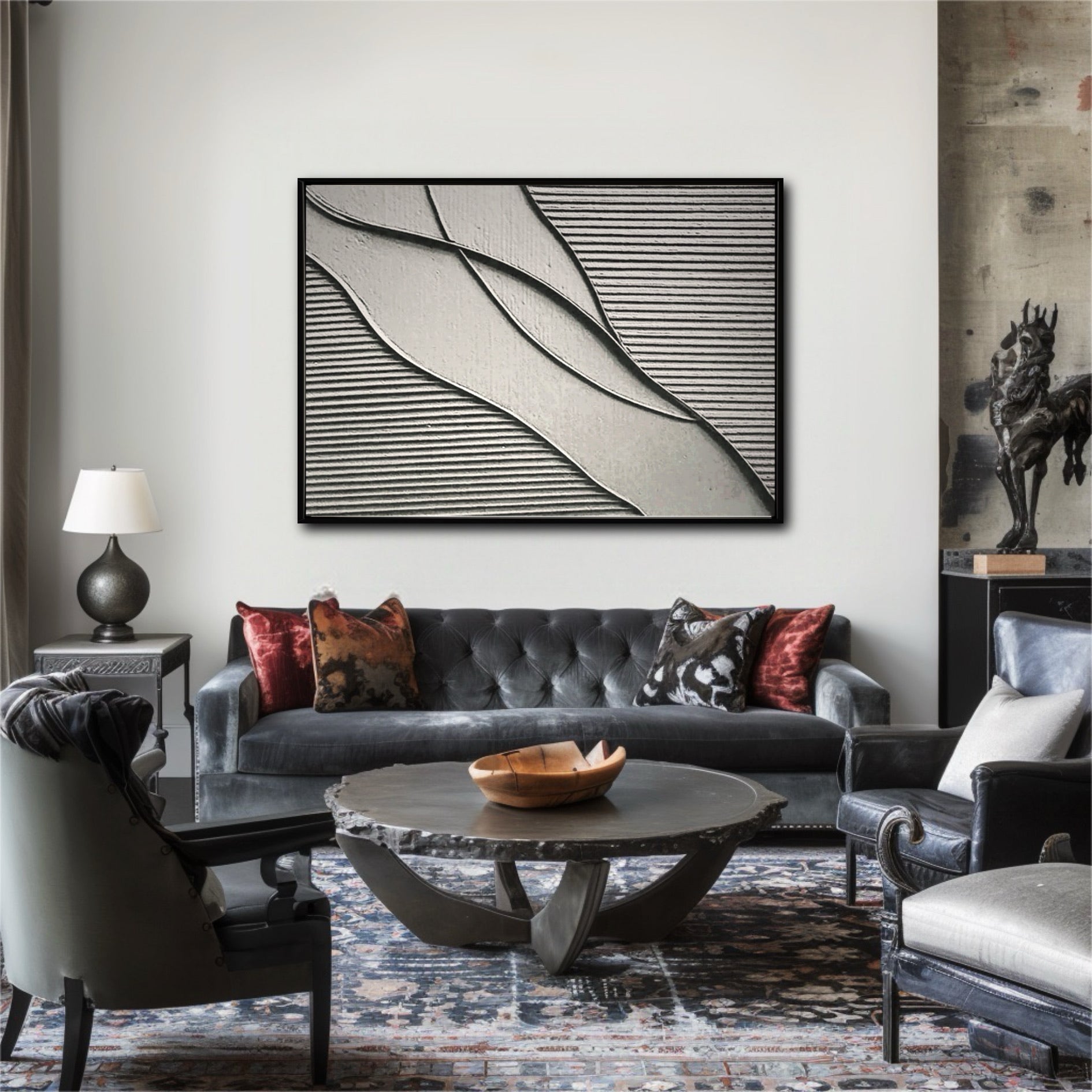 The clean, linear art piece contrasts with a dark velvet sofa and patterned rug, adding a modern touch to this eclectic living space.