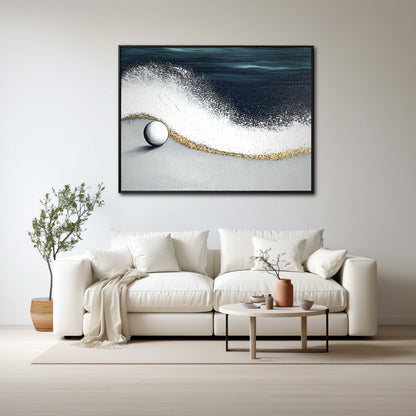 A large coastal abstract painting hangs above a plush cream sofa in a bright, minimalist living room with natural light.