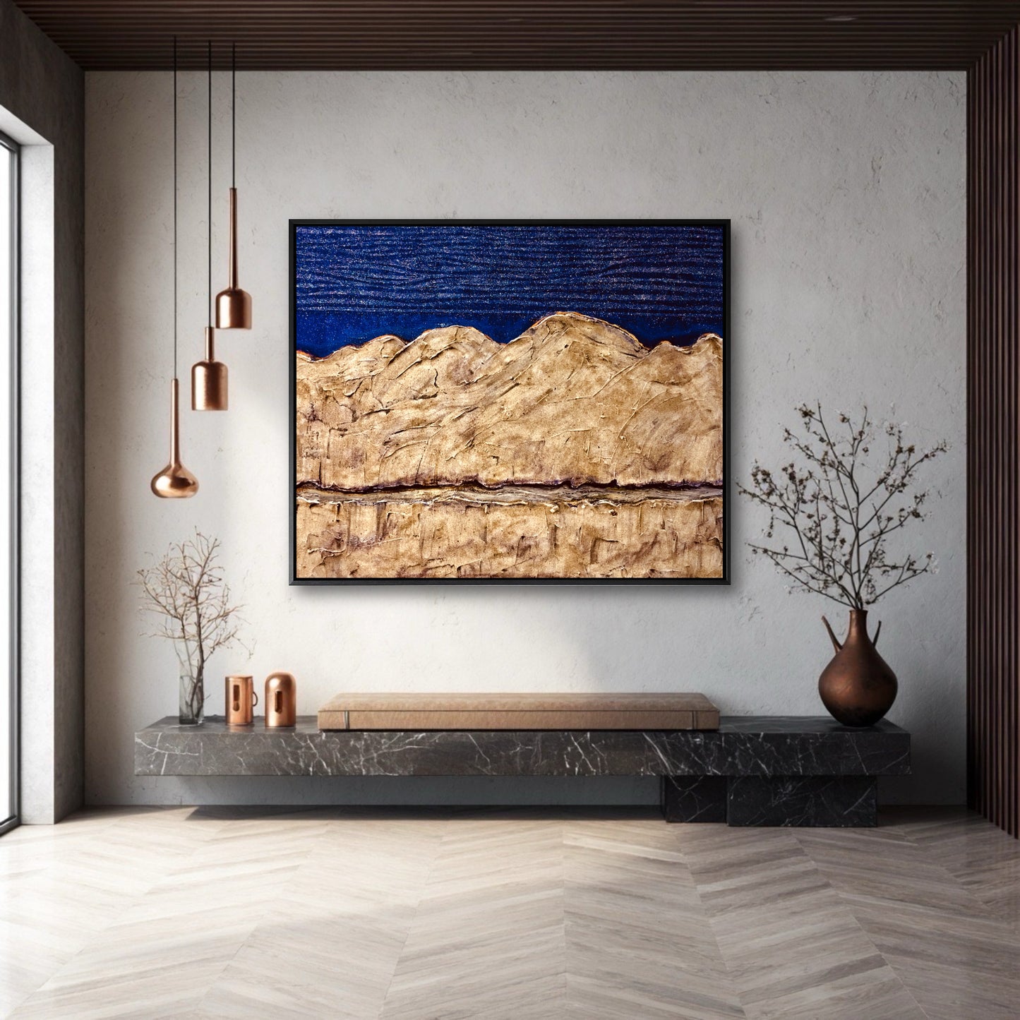 A large, textured blue and gold abstract painting hangs on a white textured wall in a modern entryway above a minimalist marble bench.