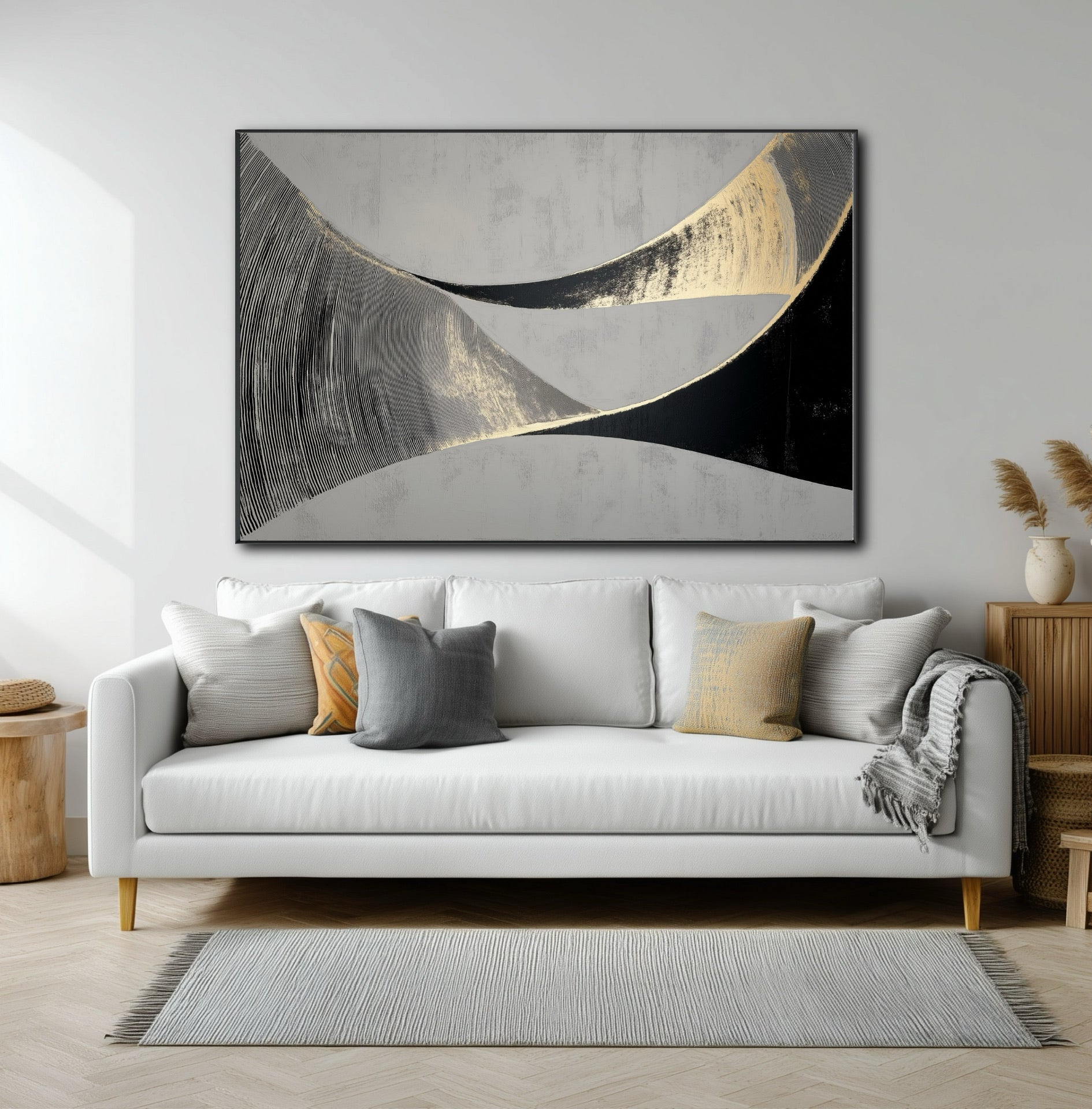 Large horizontal abstract with flowing black and gold lines over a modern white sofa in a contemporary living room.