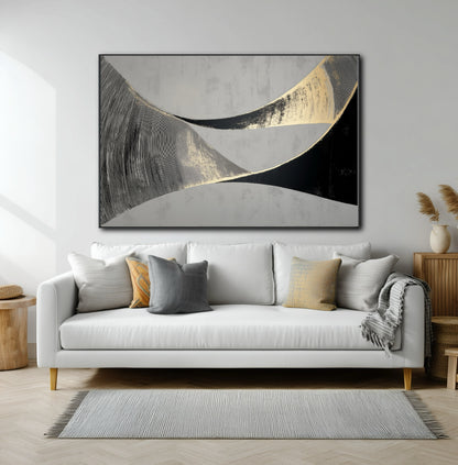 Large horizontal abstract with flowing black and gold lines over a modern white sofa in a contemporary living room.