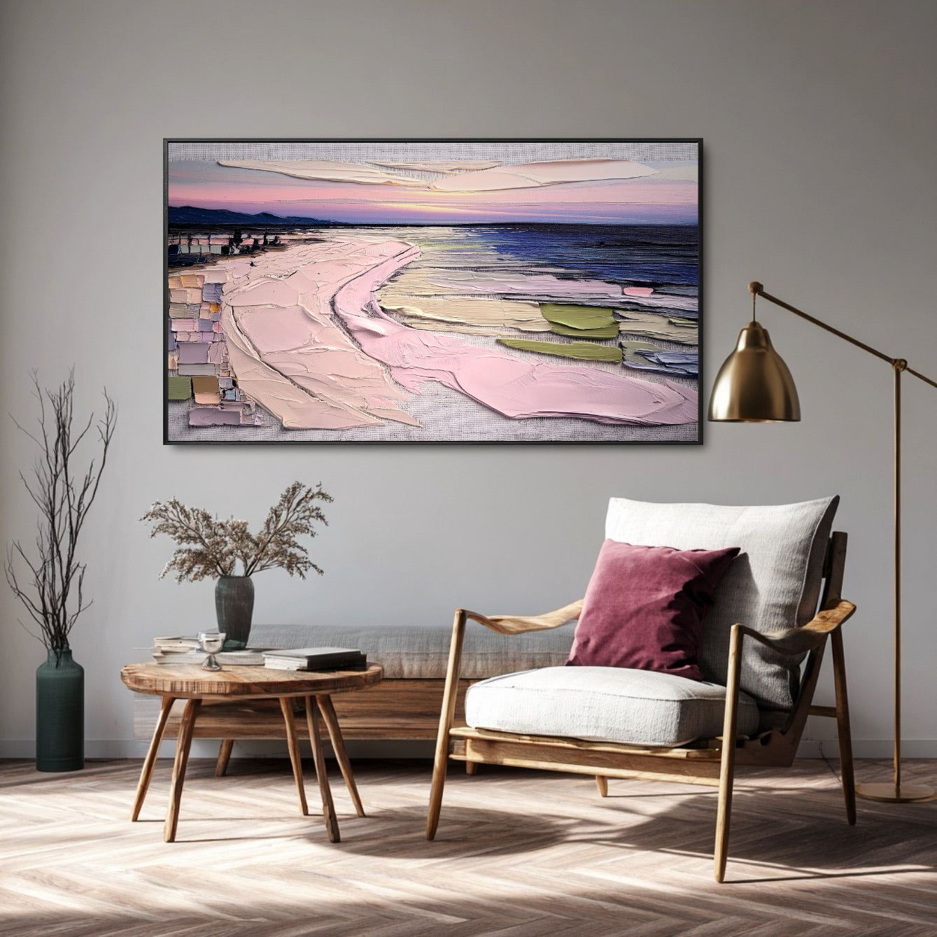 Original textured landscape art provides a vast, colorful backdrop to a minimalist reading nook with a modern wood armchair and brass floor lamp.