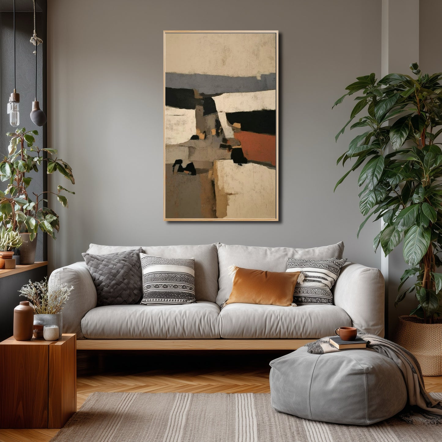 Geometric abstract art anchors a sophisticated contemporary gray living space with modern lighting, patterned pillows, and lush plants.