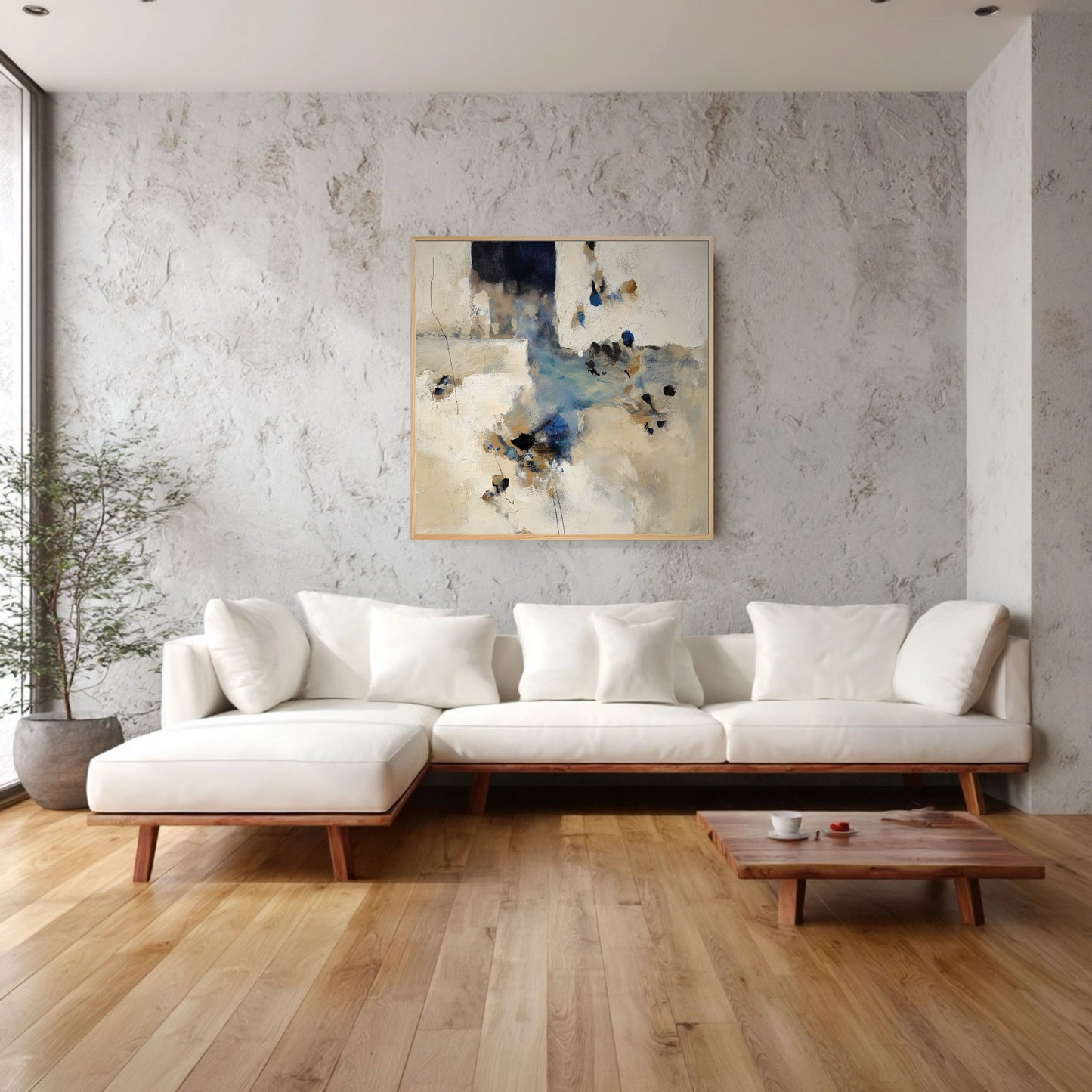 Abstract original painting complements a bright, organic modern living room; subtle wall texture and white sofa blend with the art's neutral tones and natural wood floor.
