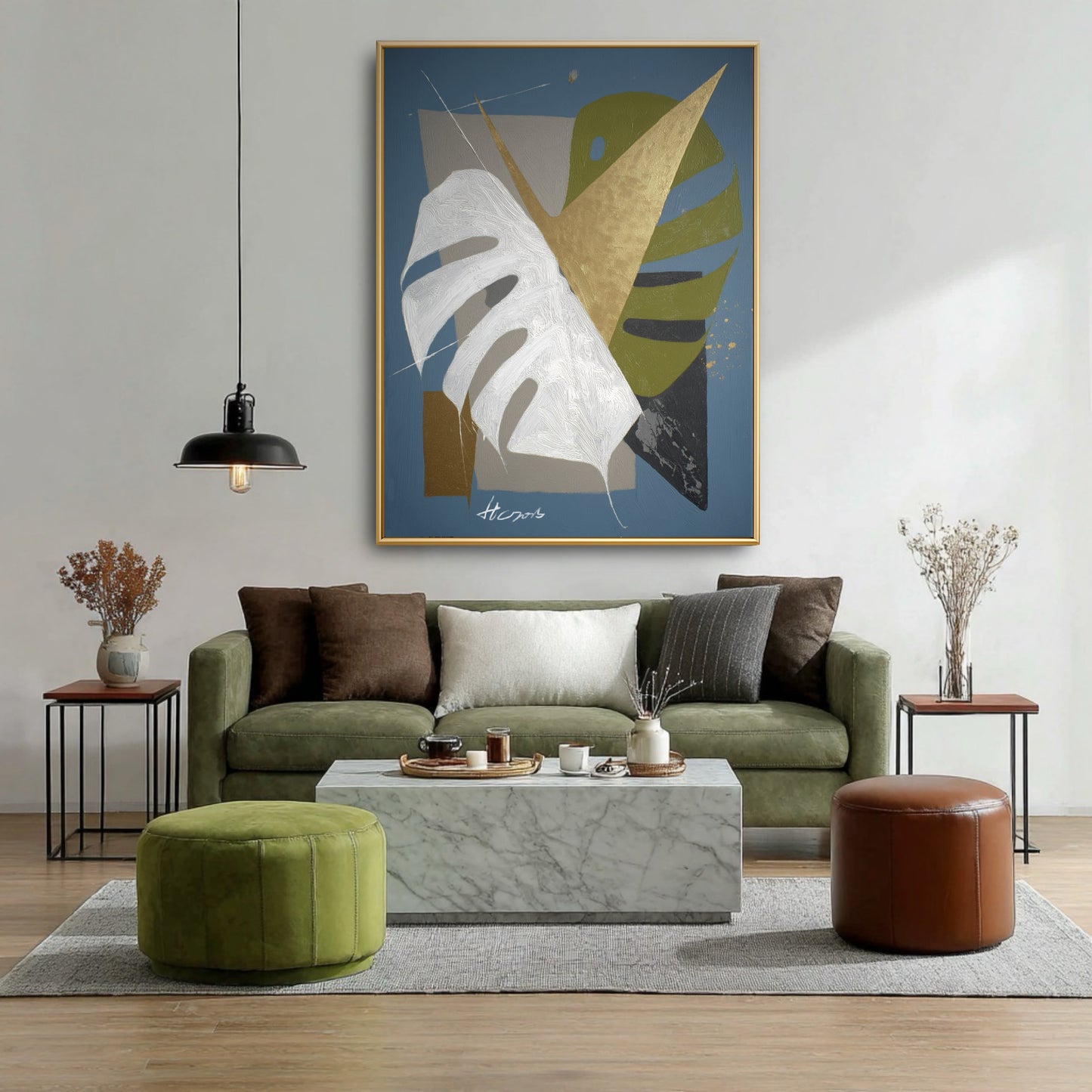 Original geometric blue painting above green velvet sofa. Abstract gold & white botanical art in modern earth-tone living room.