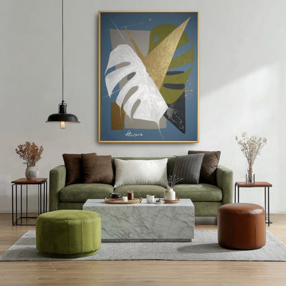 Original geometric blue painting above green velvet sofa. Abstract gold & white botanical art in modern earth-tone living room.