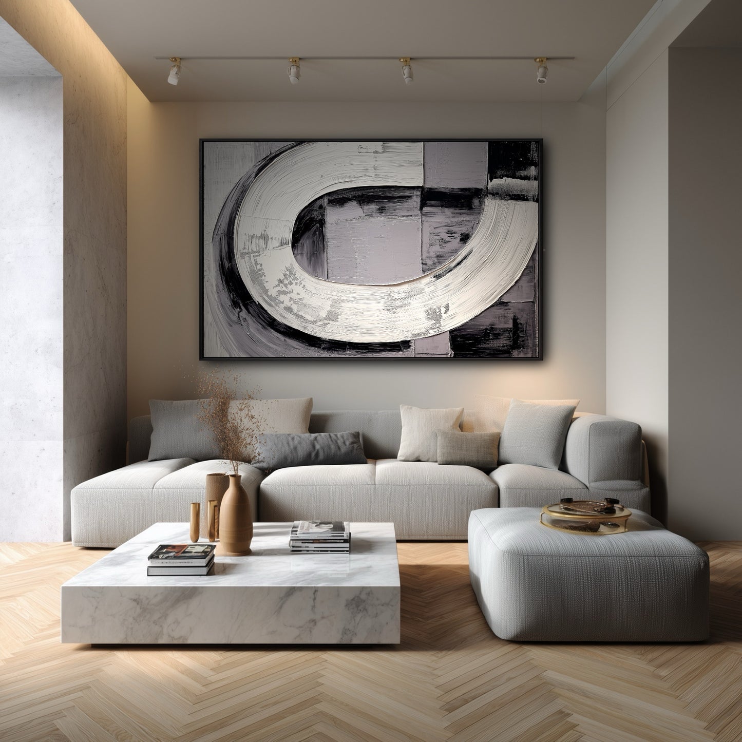 Large bold black and white abstract painting in a soft, minimalist living room with a light grey sofa and marble table.