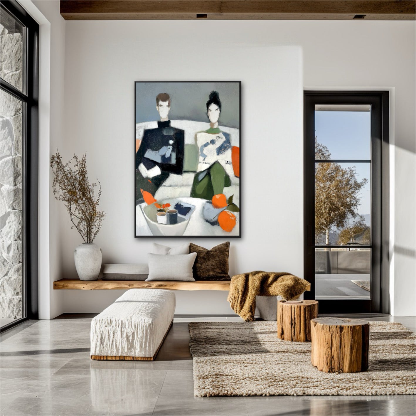 Stylish contemporary couple painting hangs in a rustic modern home. The clean lines contrast with the exposed stone wall, wood beams, and natural log side tables.