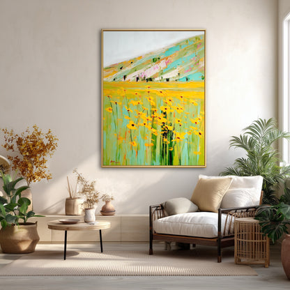 Vibrant yellow landscape art in minimalist beige room. Green & yellow flower painting creating a focal point in neutral space.