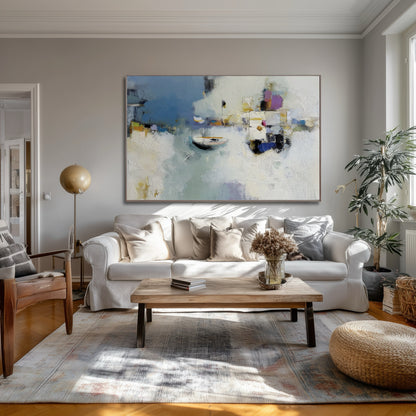 Abstract harbor reflection art adding ethereal lightness above a linen sofa, elevating the transitional room's warm wood and patterned rug.