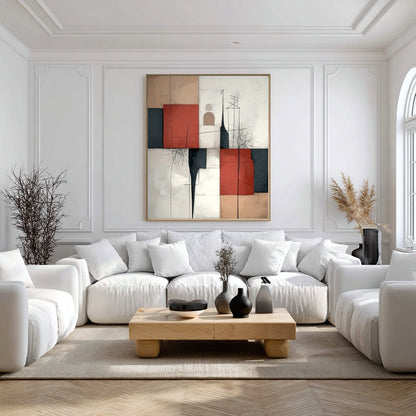 Original abstract canvas provides a powerful contrast of red and black against a completely white, formal living room with decorative wall moulding.