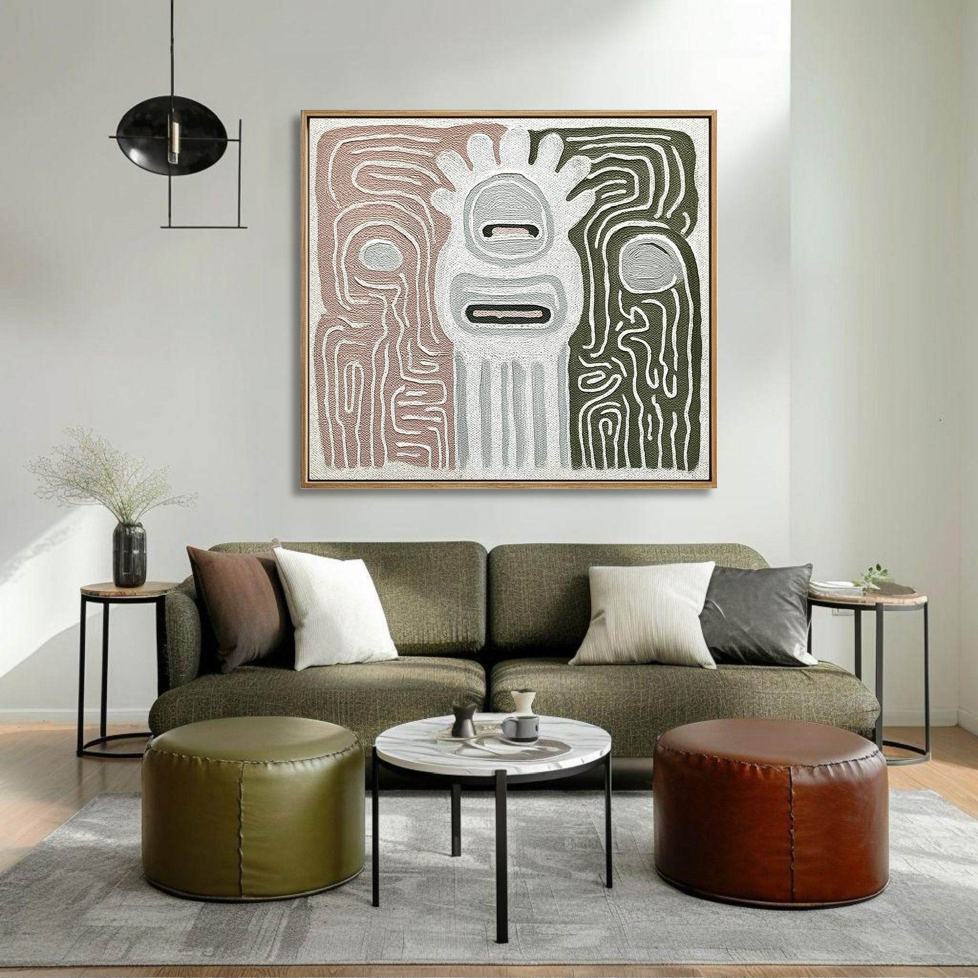 Abstract canvas featuring sage and rose tones over an olive green sofa in a relaxed, earthy-toned living space.