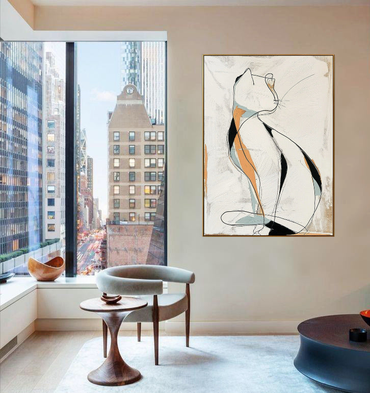 Large original abstract cat art commands attention above a low white bed in a minimalist, high-rise bedroom with natural light.