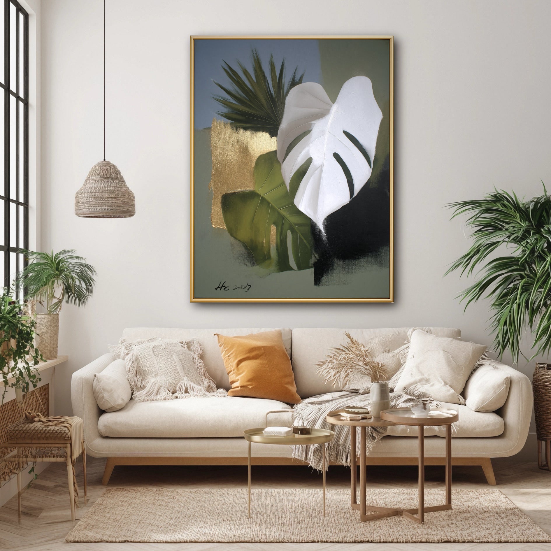 Textured Monstera wall art in a bright boho living space. Organic green and gold tones harmonize with the rattan lamp and plants.