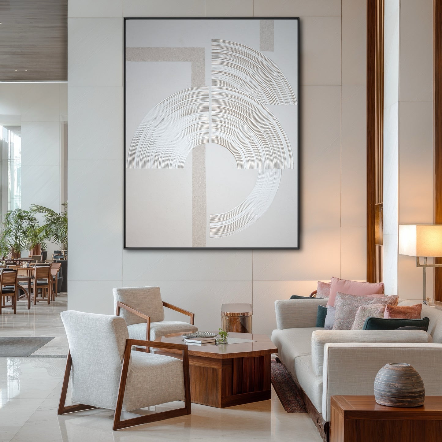 Large architectural abstract painting in a modern hotel lobby with contemporary lounge chairs and high ceilings.