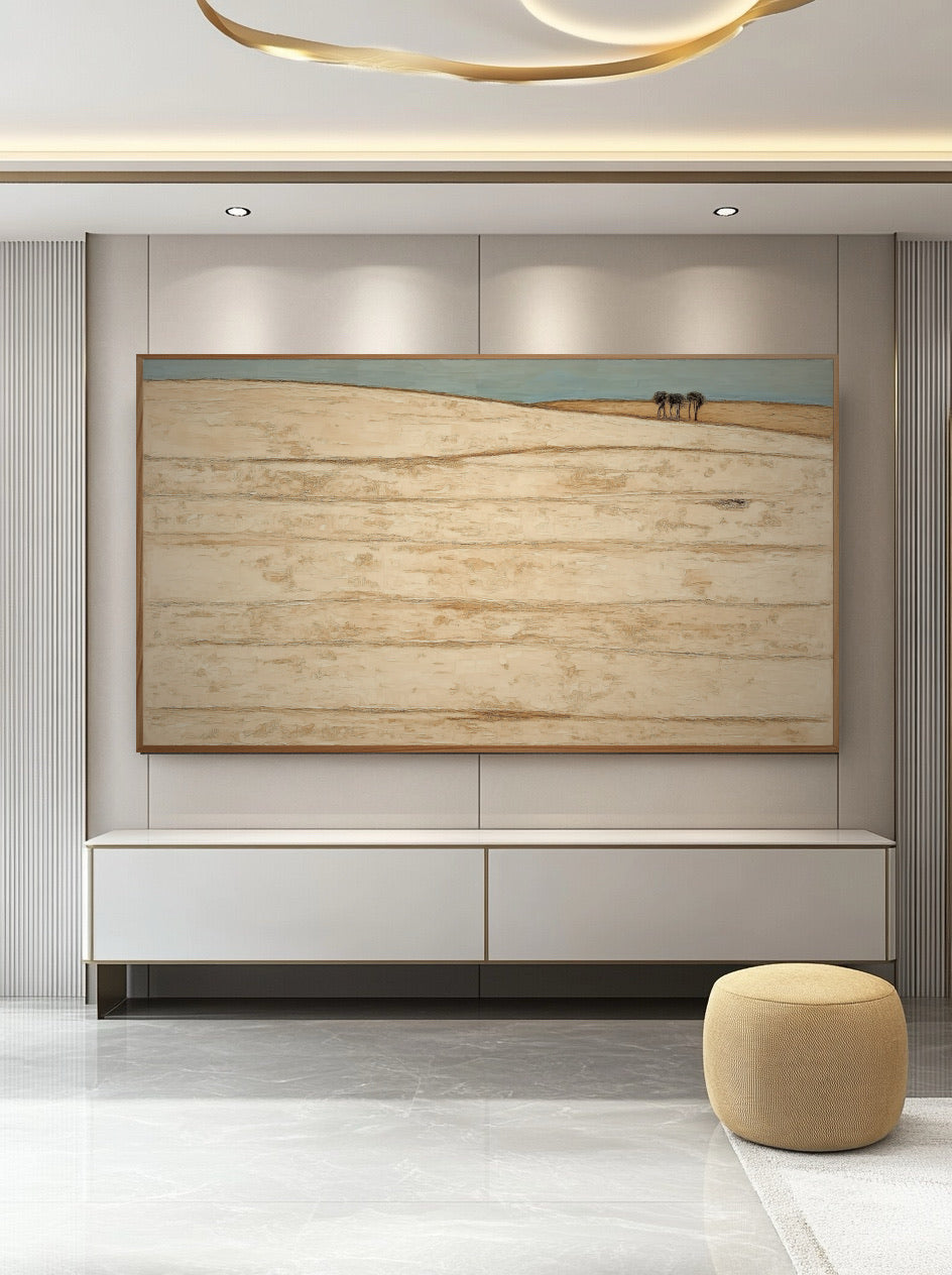 Earthy original art provides warm, organic contrast to the stark white wall panels and sleek, minimalist console in this modern luxury room.