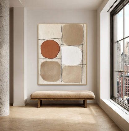 Original art above a low bench, anchoring a minimalist space with a large city-view window and concrete pillar.
