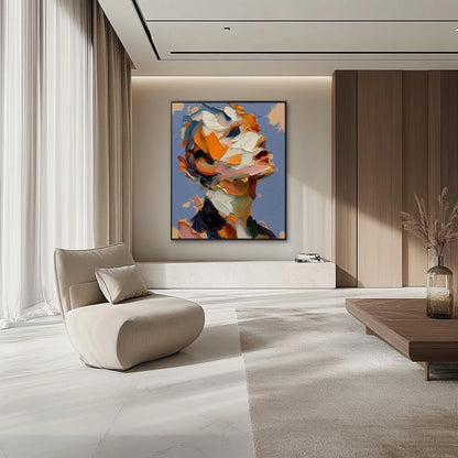 Modern living room with a colorful abstract painting on the wall, a beige armchair, and a wooden coffee table.