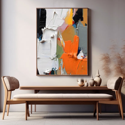 Colorful art centerpiece over a natural wood console and bench, brilliantly lit by natural light in a simple, open setting.