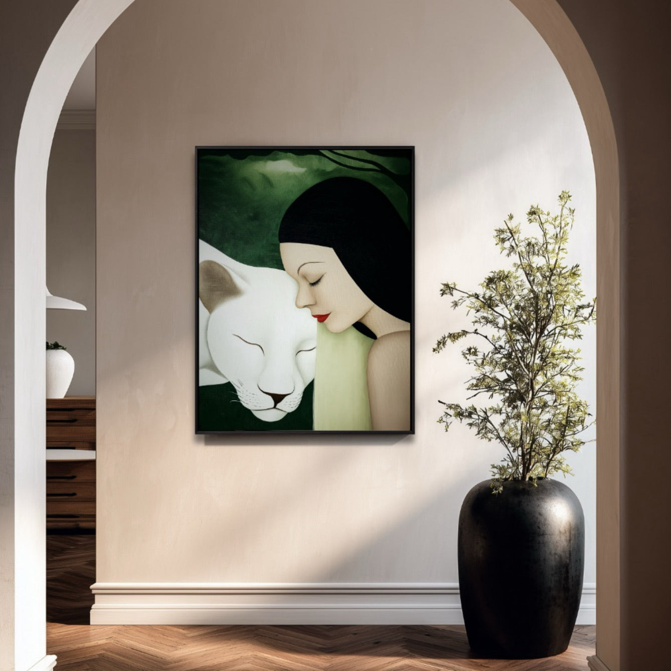 Original oil painting defines a minimalist entryway. Archways, smooth beige walls, dark planter, and subtle lighting enhance the art.