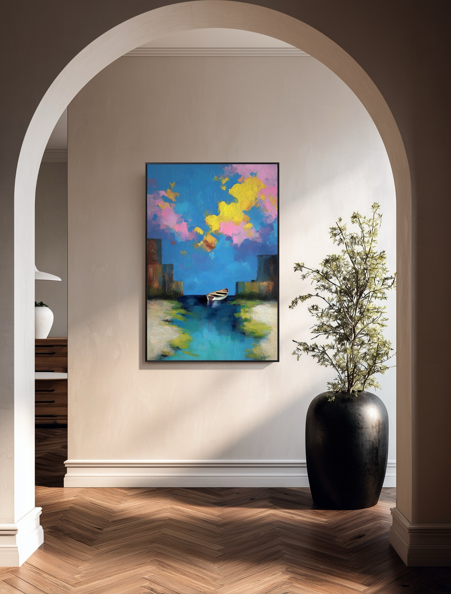 Original abstract painting creates a bright focal point in a minimalist hallway defined by soft archways and natural wood flooring.