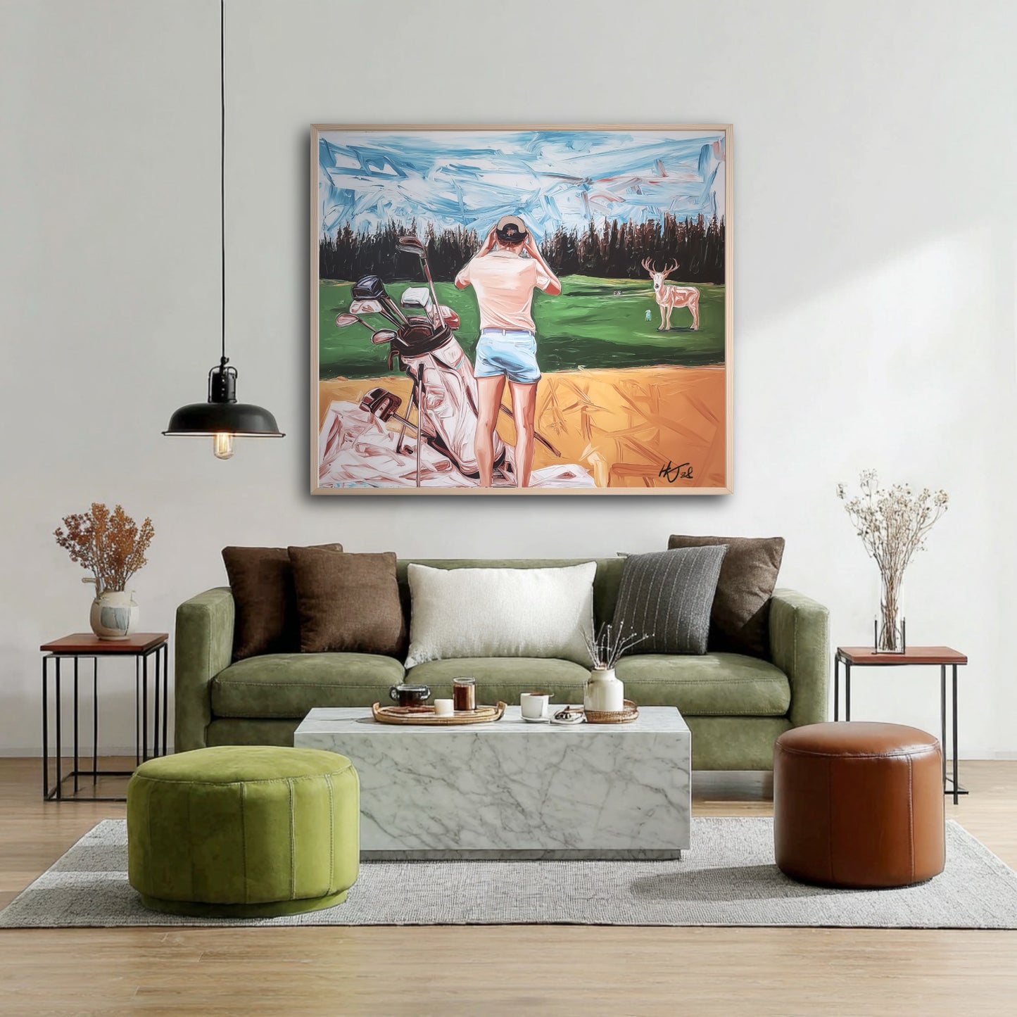 Hand-painted golf wildlife art above a green velvet sofa. Green fairway tones blend perfectly with the earthy, natural decor.