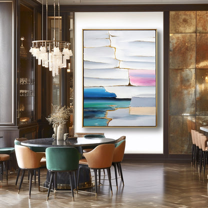 Modern dining room with abstract art on the wall and colorful chairs.