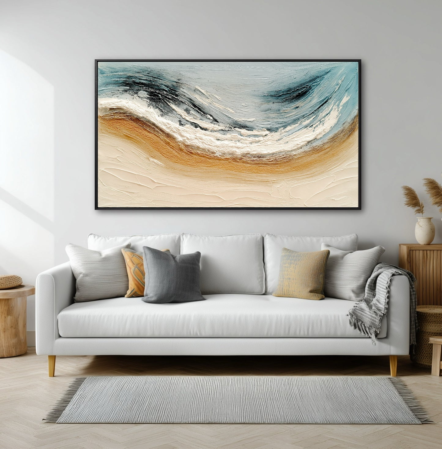 A large abstract seascape painting introduces warm gold and cool blue tones, enlivening a bright, modern living room with a white sofa.