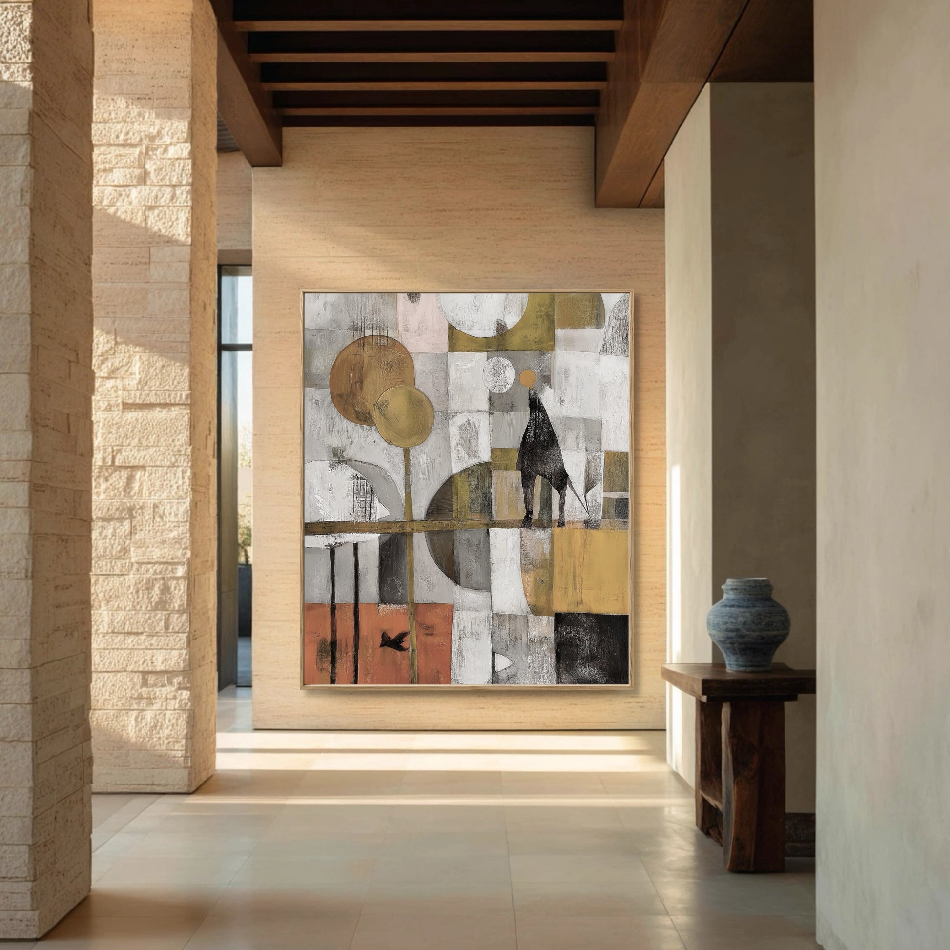 Original abstract painting brings warm color and character to the expansive, stone-columned hallway with natural light and wood beams.