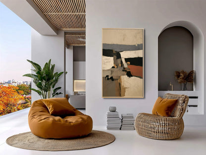 Abstract original art balances the vibrant orange pillows and rattan furniture in a chic, open-air, global-style lounge.