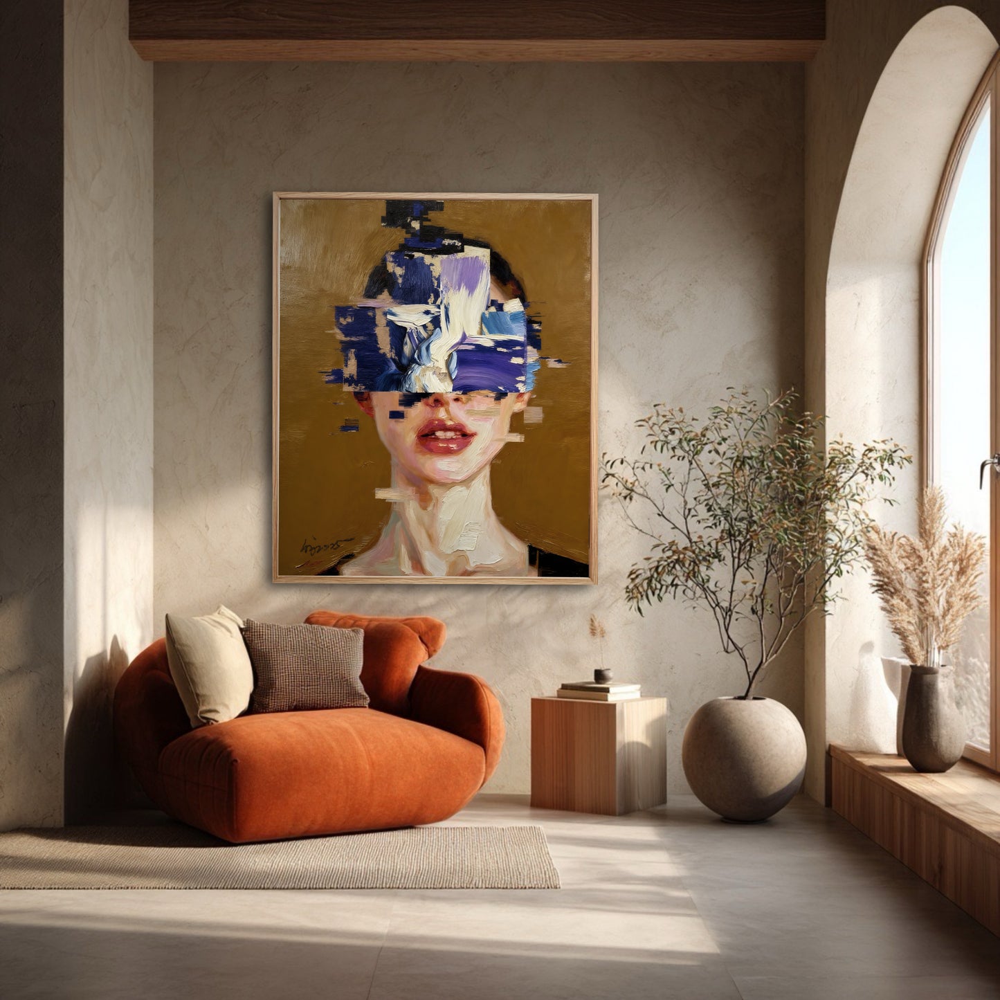 Framed abstract portrait of a woman hanging in a minimalist room with an orange armchair next to a large arched window.