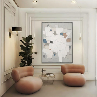 Modern living room with two pink chairs, a abstract painting, and a plant.