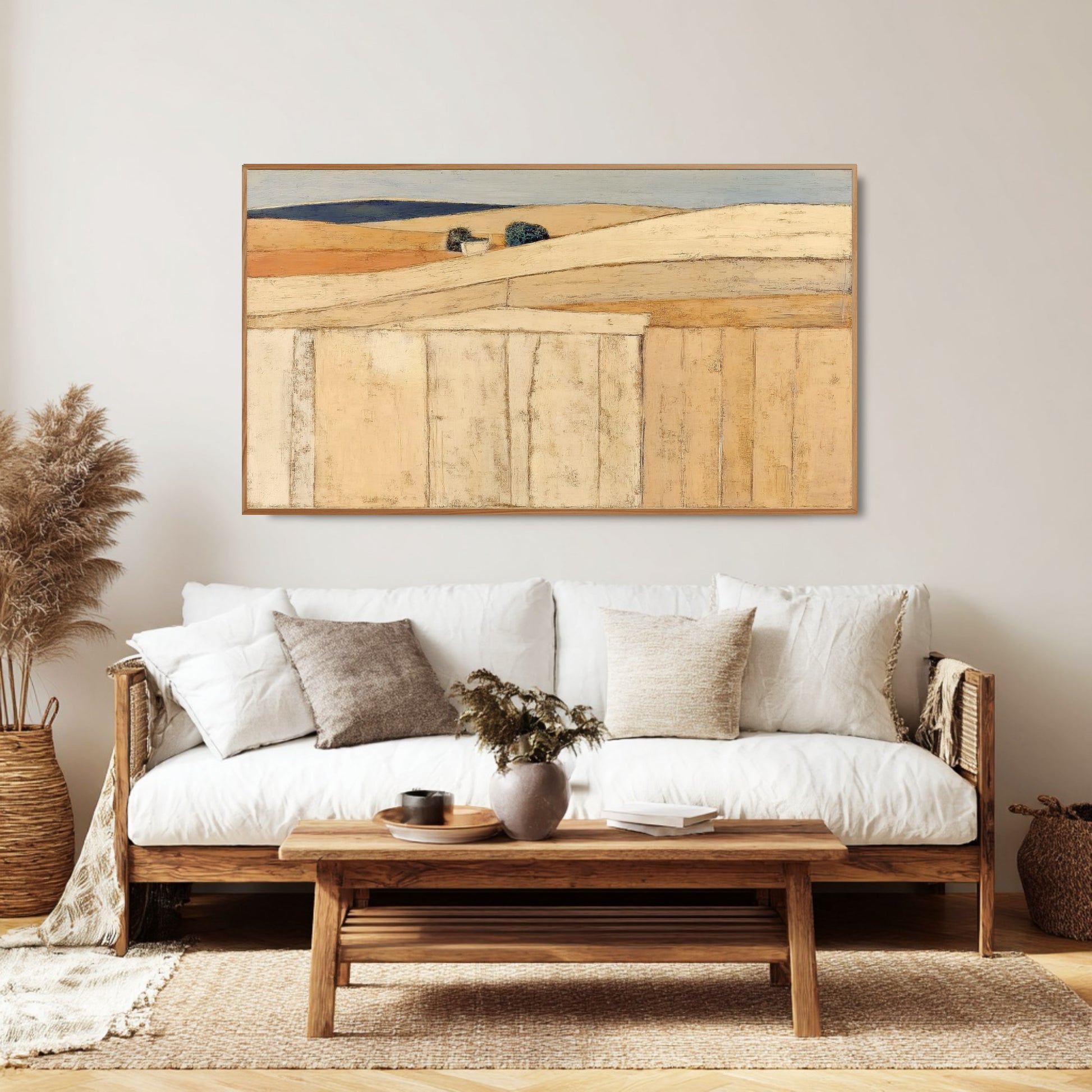 Large-scale abstract art perfectly balances the height above the textured, gray sectional sofa in a bright, modern living room space.