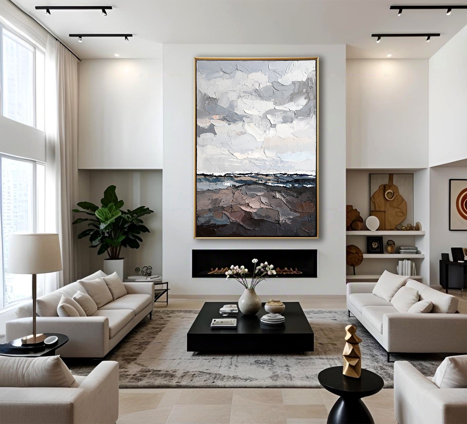 Cool abstract seascape painting above a modern fireplace in a bright, white living room with neutral furniture.
