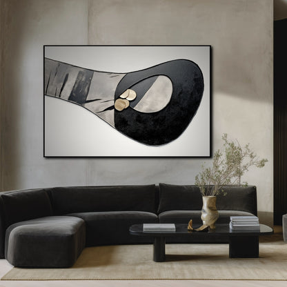 Large biomorphic abstract art with gold accents hanging over a dark velvet sectional sofa in a moody minimalist room.