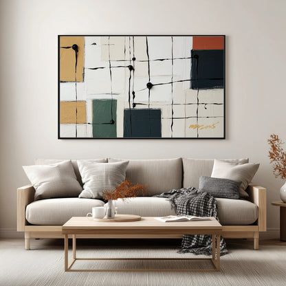 Original art over a minimalist wood sofa, complementing the neutral beige textiles and relaxed modern aesthetic.