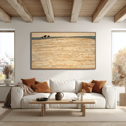 Gold-toned abstract art perfectly mirrors the warm wood ceiling beams and accent pillows over the white sofa in this bright, rustic space.