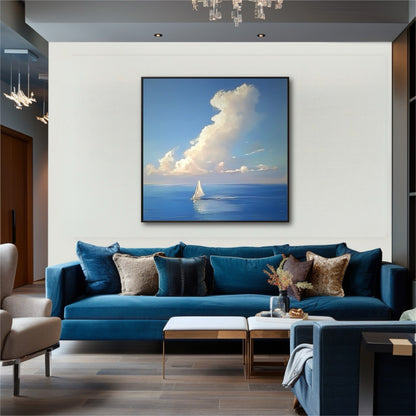 Modern living room with a blue velvet sofa, where a large, bright sailboat painting hangs on a white wall as a focal point.