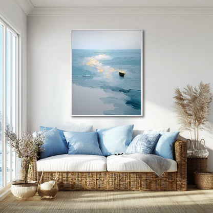 Original nautical painting above a wicker couch with blue pillows; the cool blue art complements the cozy, light-filled coastal-style living room.