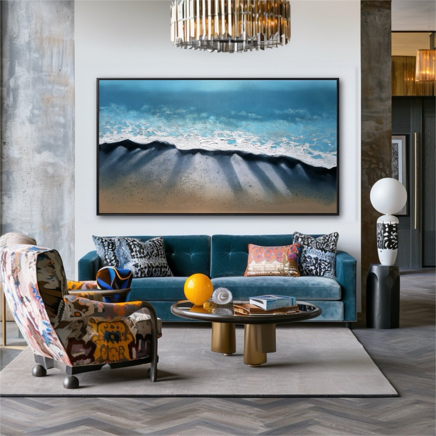 The large coastal painting anchors an eclectic room, its blue tones complementing the velvet sofa amid bold patterns and textures.