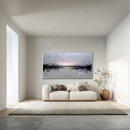 Modern living room with a sofa, rug, and wall art