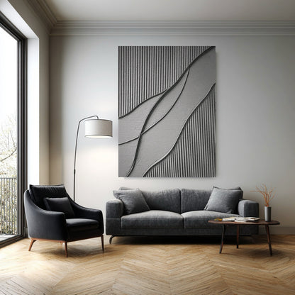 Original art on concrete wall in a high-ceiling industrial loft with massive windows, dark furniture, and raw wood credenza.