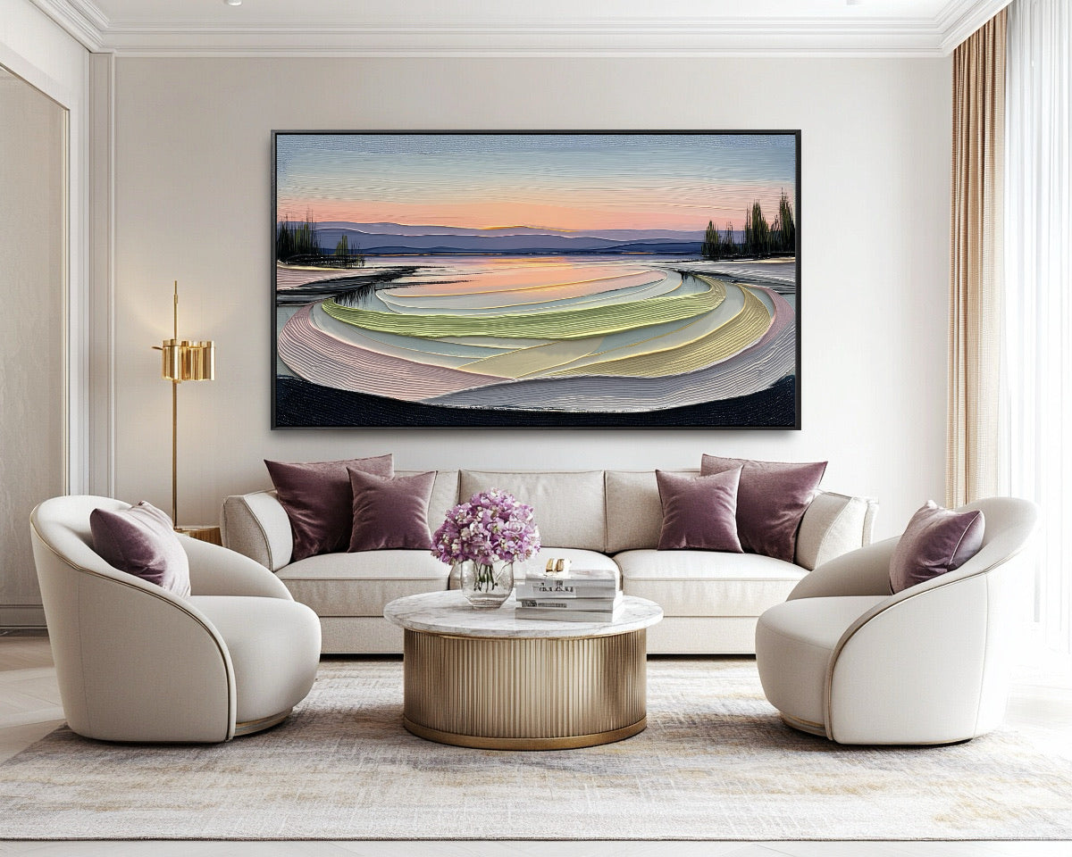 Original abstract landscape artwork provides a calm, colorful focus above a cream sofa, complemented by elegant velvet chairs and purple pillows.
