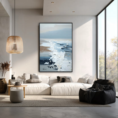 The tall, vertical seascape painting enhances the high ceiling, adding an organic, calming vibe to this modern, large-windowed room.