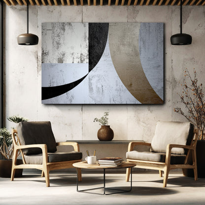 Horizontal abstract with a distressed texture on a concrete wall above two modern armchairs in an industrial-style room.
